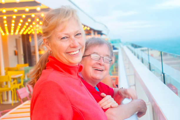istock Two women enjoy the view on deck of a ship 2181987689