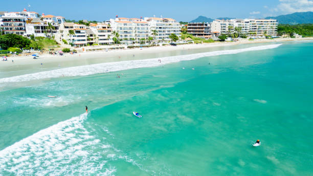 Surfers at the Hotel Zone Beach in Punta Mita, Nayarit. Mexico