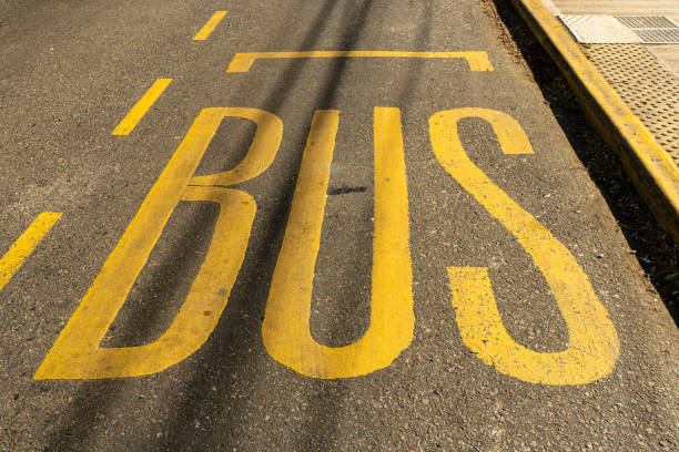 Yellow school bus with stop sign deployed. Safety, transportation, education.