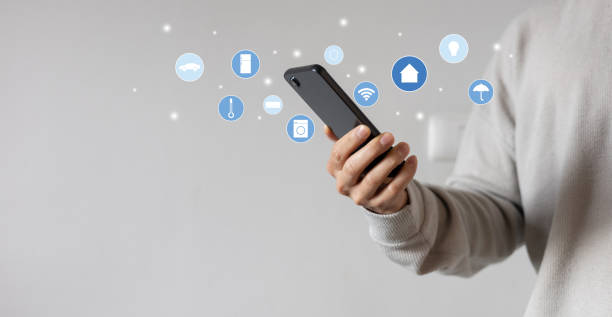 istock close up man hand holdings smartphone and open application technology for using home automation function with wifi 7  to looking inside or outside home and property for  ai innovation future concept 2181996386