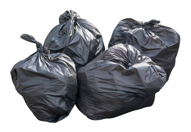 istock Front view of garbage in black plastic bag at garbage dump isolated on white background with clipping path 2181998601