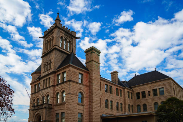 Springfield Historic City Hall, built in 1891, at Government Plaza in Greene County, Missouri, USA: A three-story, L-shaped, Romanesque Revival style limestone block building