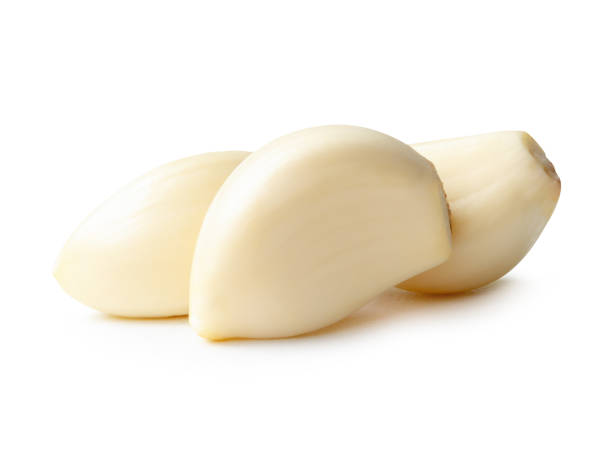 istock Side view of peeled garlic cloves in stack isolated on white background with clipping path 2181999857