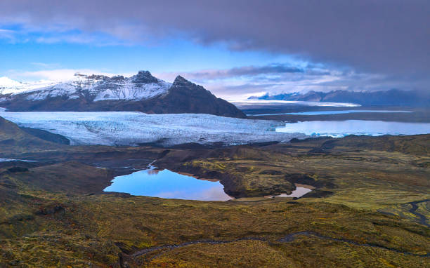 iceland glacier with snow capped mountains