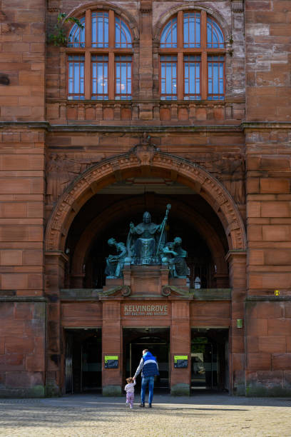 Glasgow, Scotland - People on the pavement ahead of the Kelvingrove Museum in the West End of Glasgow.