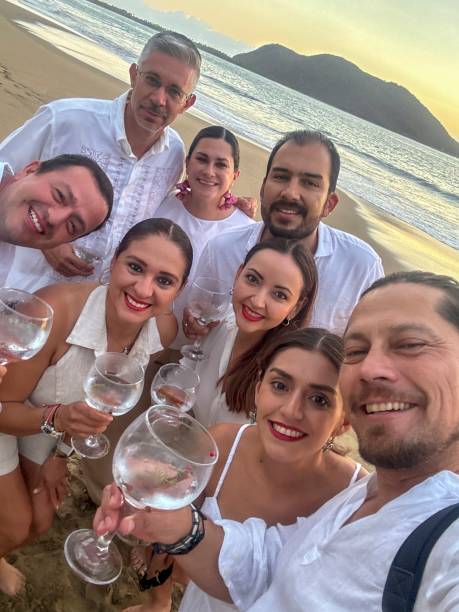istock friends toasting to friendship on the beach 2182000816