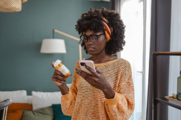 istock Woman reading medication instructions on her smartphone 2182001164