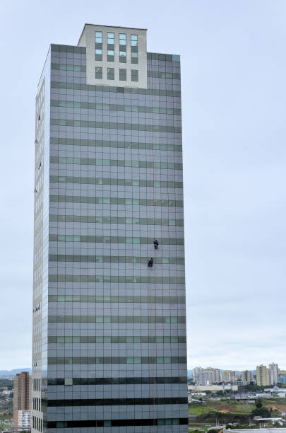 istock High altitude cleaning workers cleaning the windows of the building 2182002321