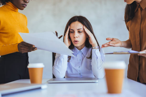istock Stressed Businesswoman Overwhelmed During Office Meeting 2182007451