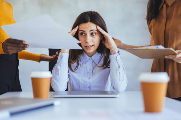 istock Stressed Businesswoman Overwhelmed With Numerous Tasks at Office 2182007537