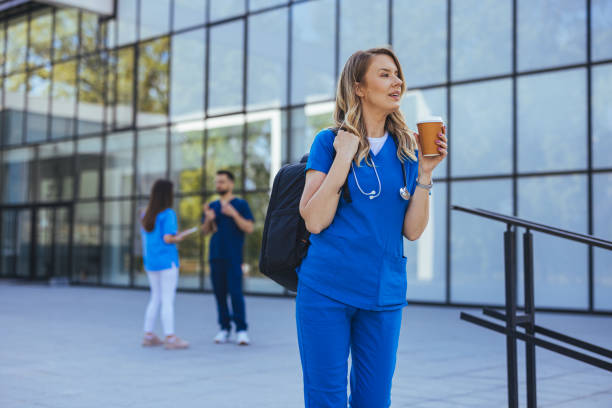 istock Confident Nurse Holding Coffee Outside Modern Hospital Building 2182007767