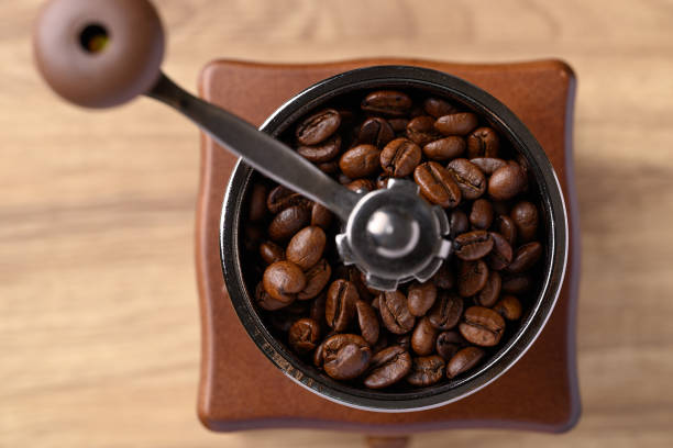 istock Roasted coffee bean (Arabica coffee) in vintage grinder with handle 2182008302