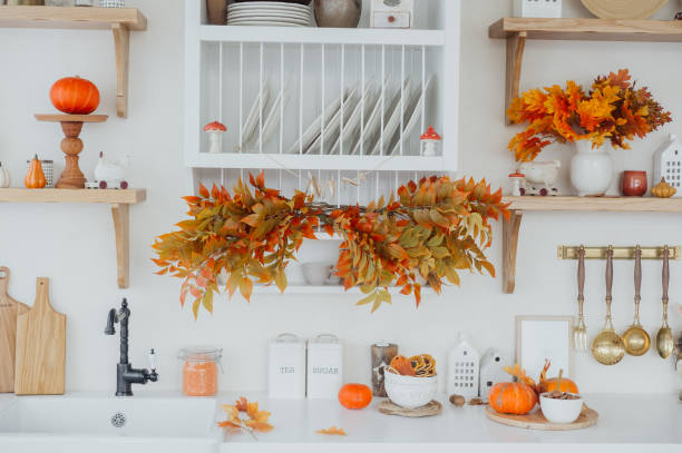 istock Autumn kitchen decor featuring vibrant leaves and pumpkins in a cozy setting 2182008445