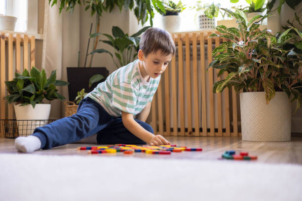 istock A European boy plays on the floor with construction set. A white child assembles a circula 2182029581