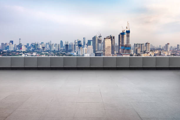 istock Empty rooftop balcony with view of modern building skyscrapers and futuristic architecture with sunset scene 2182029722