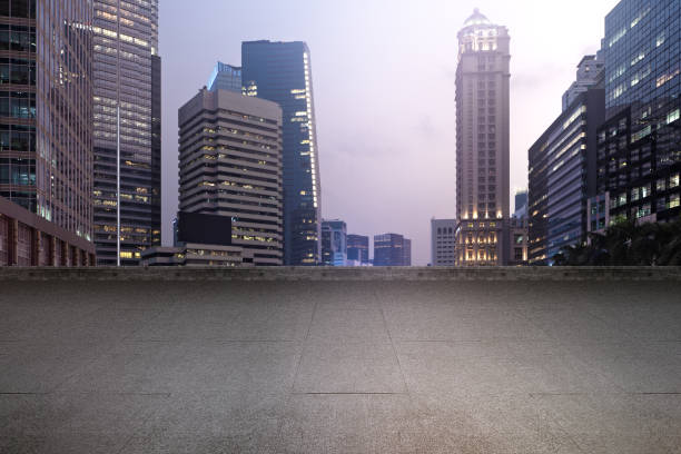 istock Empty rooftop balcony with view of modern building skyscrapers and futuristic architecture with sunset scene 2182029727