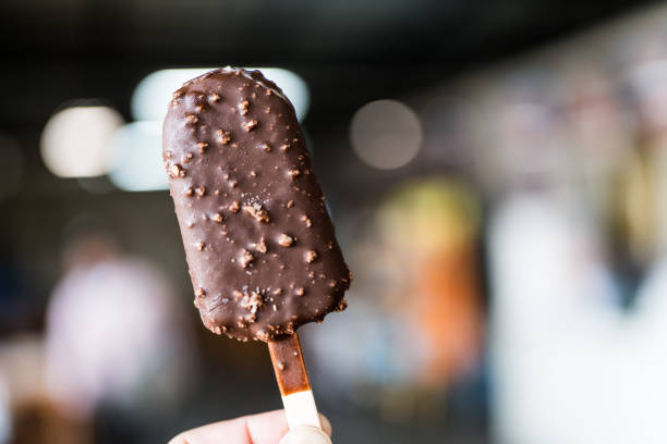 istock Chocolate popsicle ice cream bar with crushed peanut nuts. 2182034431
