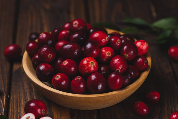 istock Cranberry berries in a wooden plate 2182034820