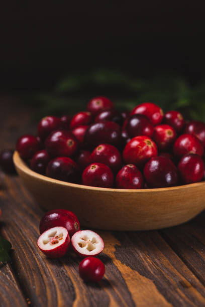 istock Cranberry berries in a wooden plate 2182034842