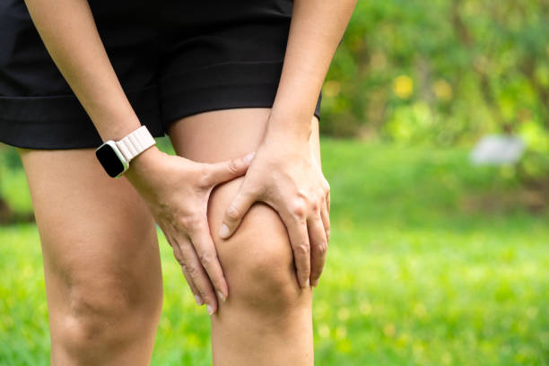 istock Knee pain man He puts his hands on his knees, pain points from osteoarthritis and bone diseases, medical concepts and treatments. 2182035309