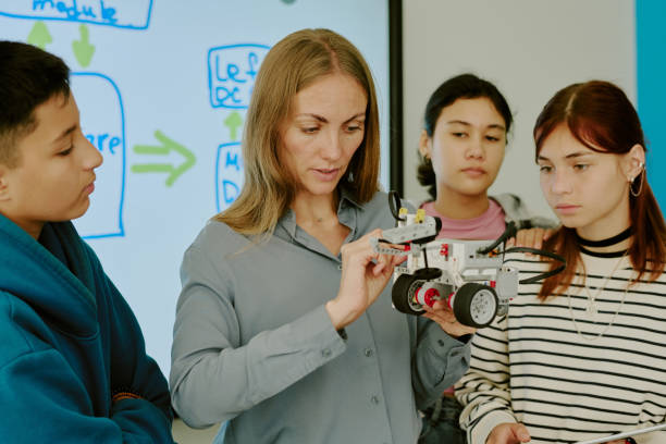 istock Teacher Telling About Robot Parts 2182037372