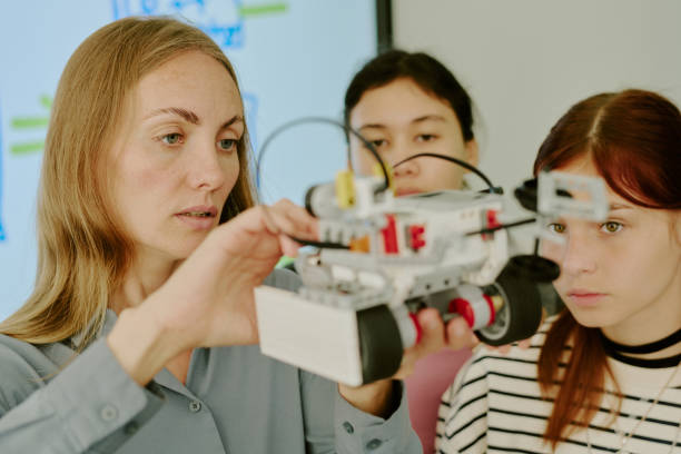 istock Robot in Hands of Teacher 2182037383