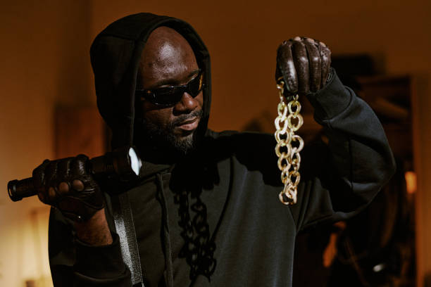istock Huge Heavy Golden Necklace in Thiefs Hands 2182042678