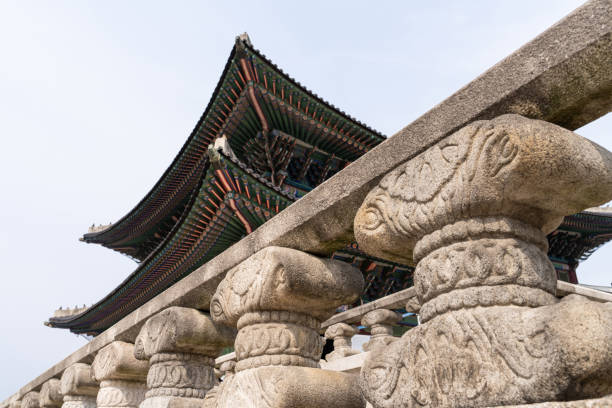 istock stone fence and sculpture 2182043685