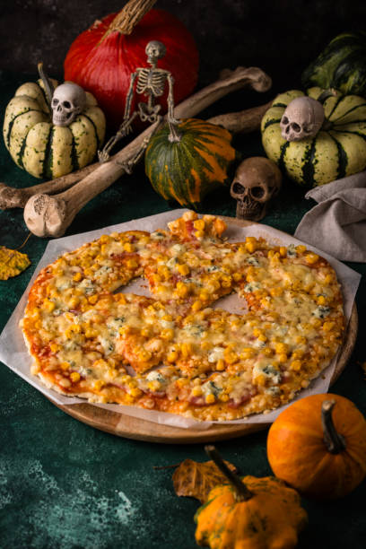 istock Halloween scary pizza in shape of pumpkin 2182043763