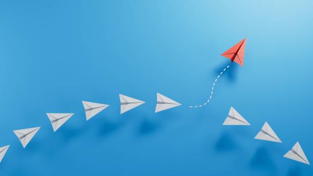 istock Business for new ideas creativity, innovative and solution concepts. Group of blue paper plane in one direction and one red paper plane pointing in different way.3D rendering on blue background. 2182044223