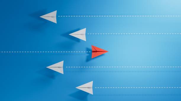 istock Business for new ideas creativity, innovative and solution concepts. Group of white paper plane in one direction and one red paper plane pointing in different way.3D rendering on blue background. 2182044300