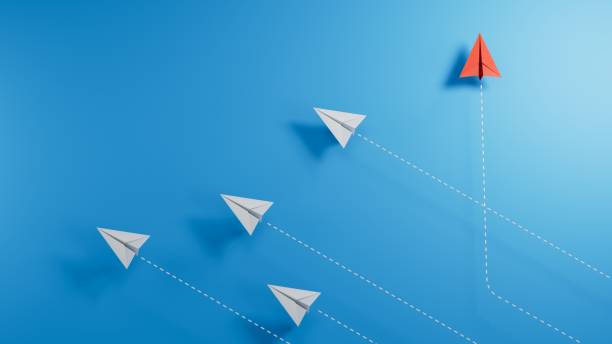 istock little airplanes and a red one symbolizing a different approach on paper background.new ideas. paper art style. creative idea.3D rendering on blue background. 2182044689