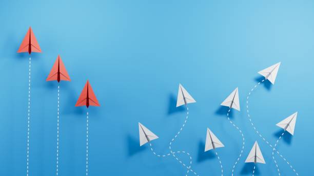 istock one red paper plane pointing in different way on blue background. Business for new ideas creativity and innovative solution concepts.3D rendering on blue background. 2182044729