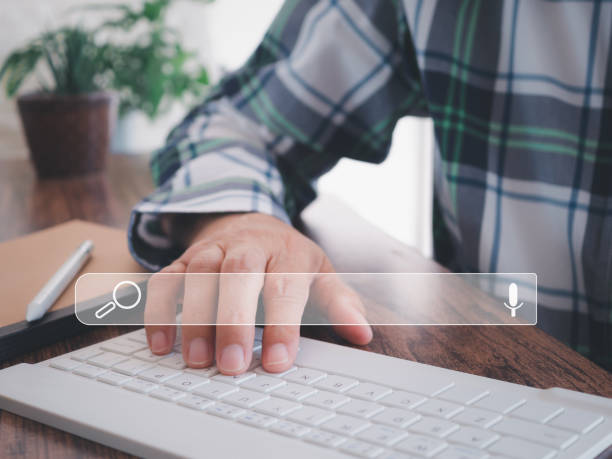 istock Hand of keyboard computer show icon search engine bar. Searching browsing Internet data information data online search concept. 2182045301