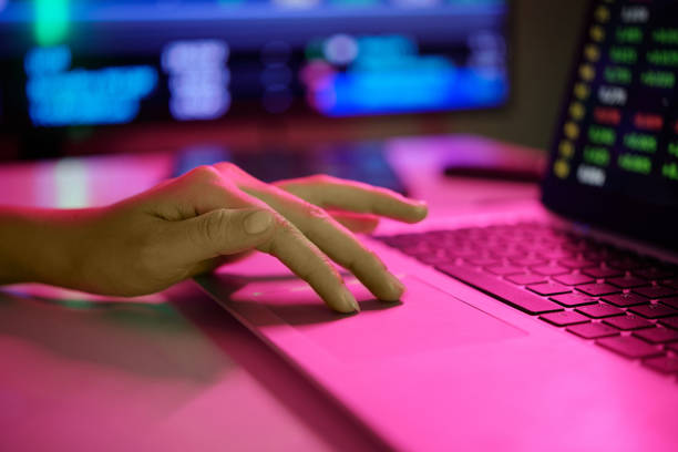 istock Typing on Laptop in Dimly Lit Office Environment 2182046537
