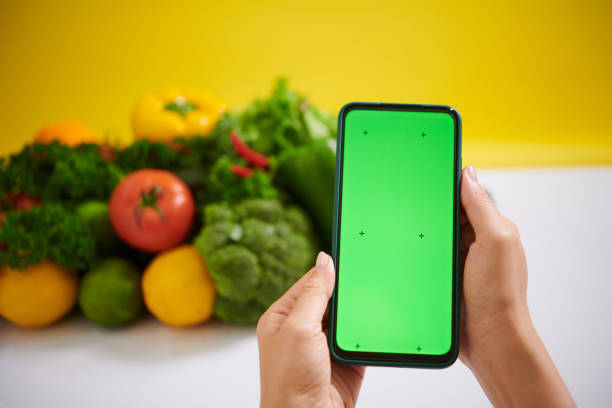 istock Capturing Fresh Vegetables with a Green Screen Smartphone 2182046586
