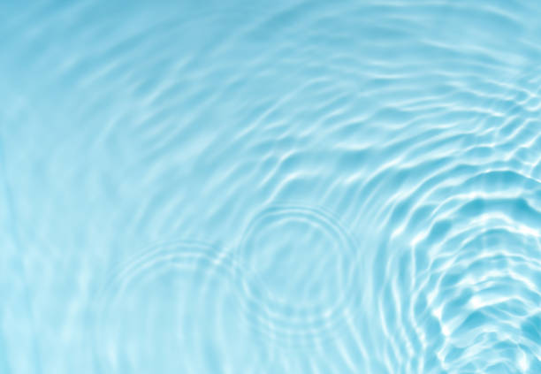 Water in swimming pool rippled water detail background.  Blue in the water in the swimming pool.