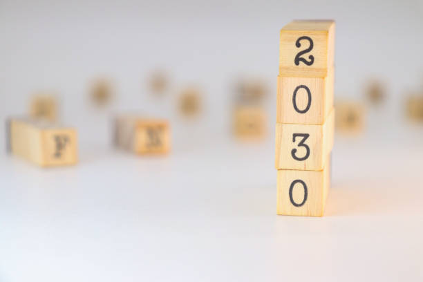 istock Year 2030 design. Numbers written on wooden cubes 2182048512