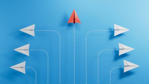 istock Think different' - individuality concept. Individual and unique leader paper plane flies forward.3D rendering on blue background. 2182049082