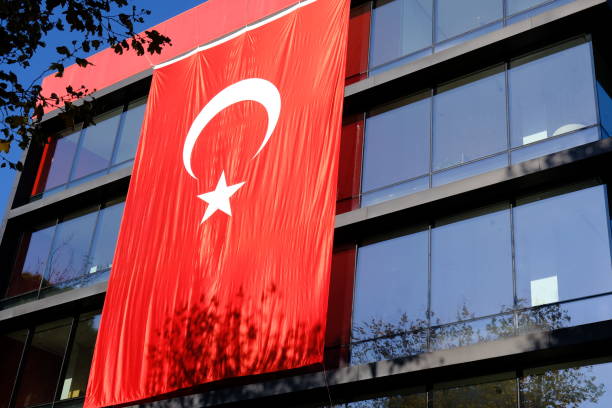 istock Turkish Flag with red crescent and star hanging on a building. 2182053560