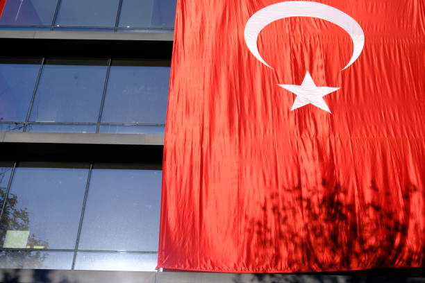 istock Turkish Flag with red crescent and star hanging on a building. 2182053670