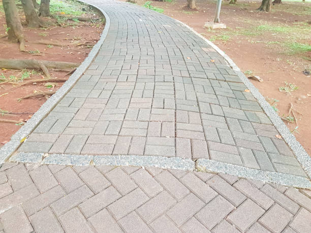 istock stone path made of decorative tiles in the garden 2182059151