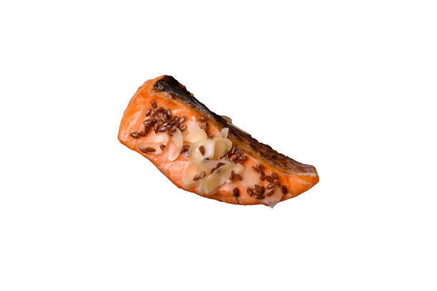 istock Grilled salmon with salt and spices, broccoli, tomatoes, rice 2182059515