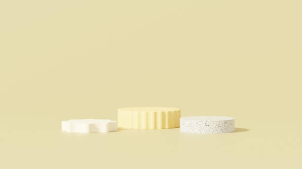 istock 3D rendering of a yellow empty podium display space for product mockup, set against a minimal landscape background. 2182061873