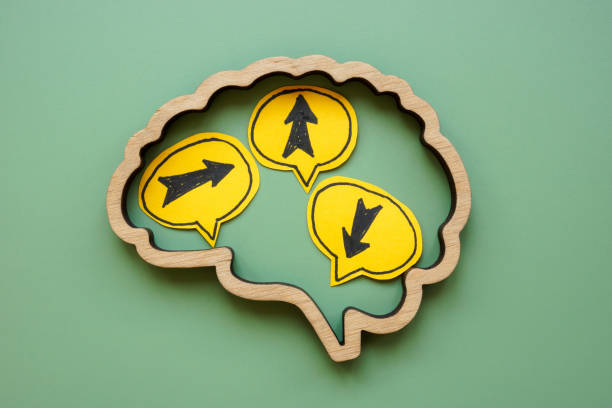 istock Brain outline with arrows pointing in different directions. Doubt and indecision. 2182062771