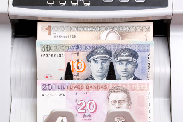 istock Lithuanian litas in the counting machine 2182063143