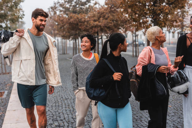 istock Athletes walking and talking together after training in the city 2182064332