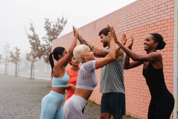 istock Athletes giving high five after training in the city 2182064713