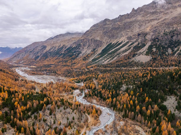 istock Majestic Mountain Valley with Autumn Trees and Glacial View 2182065323