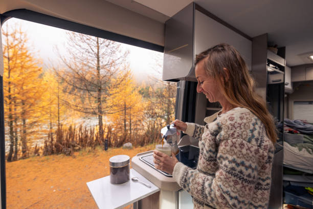 istock Woman Enjoying a Warm Coffee Moment in Camper Van 2182067878